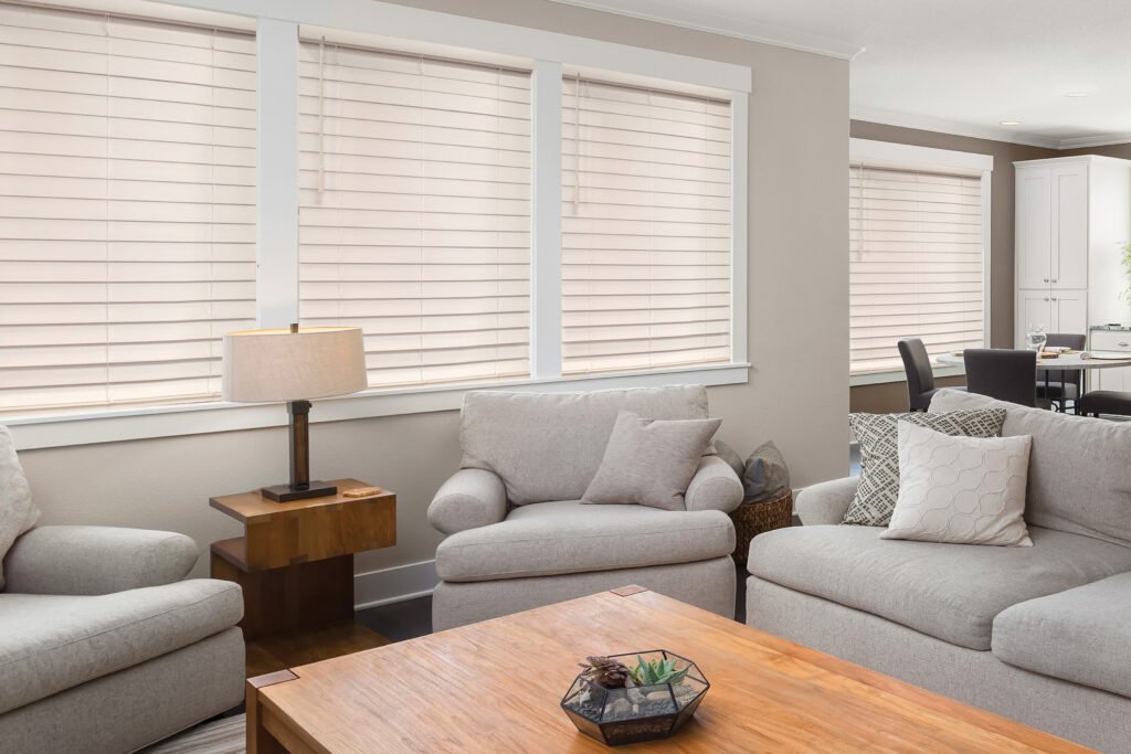Window Blinds in Lake Keystone - FL near me being measured by an installer beside tall living room windows