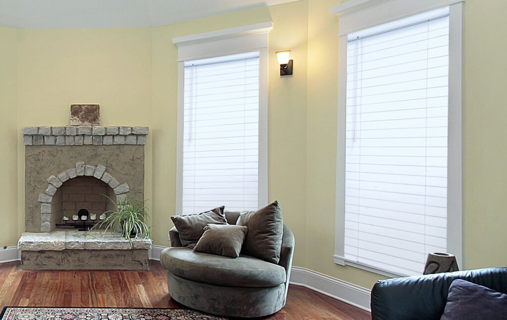 Installer adjusting Window Blinds inside a bright Lake Keystone - FL home to improve privacy and glare control