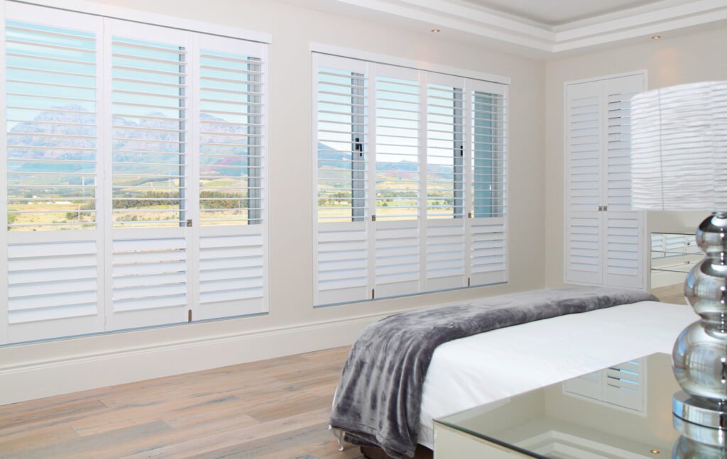 Installer adjusting Plantation Shutters in a Tierra Verde - FL bedroom near me.