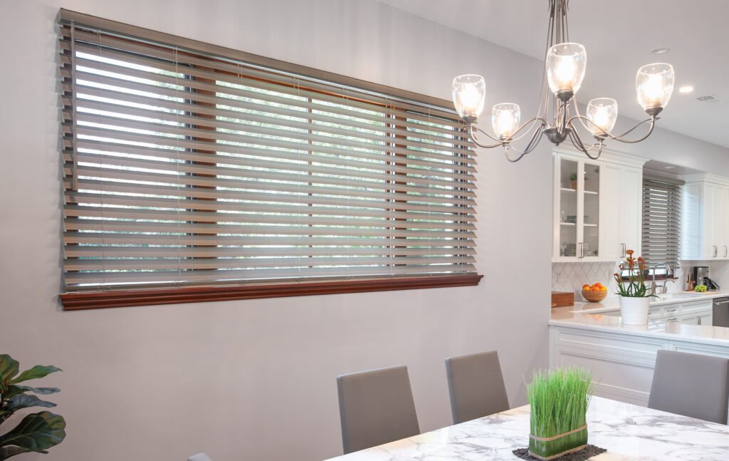 Installer adjusting Window Blinds in a Keystone - FL bedroom to improve privacy and morning light control